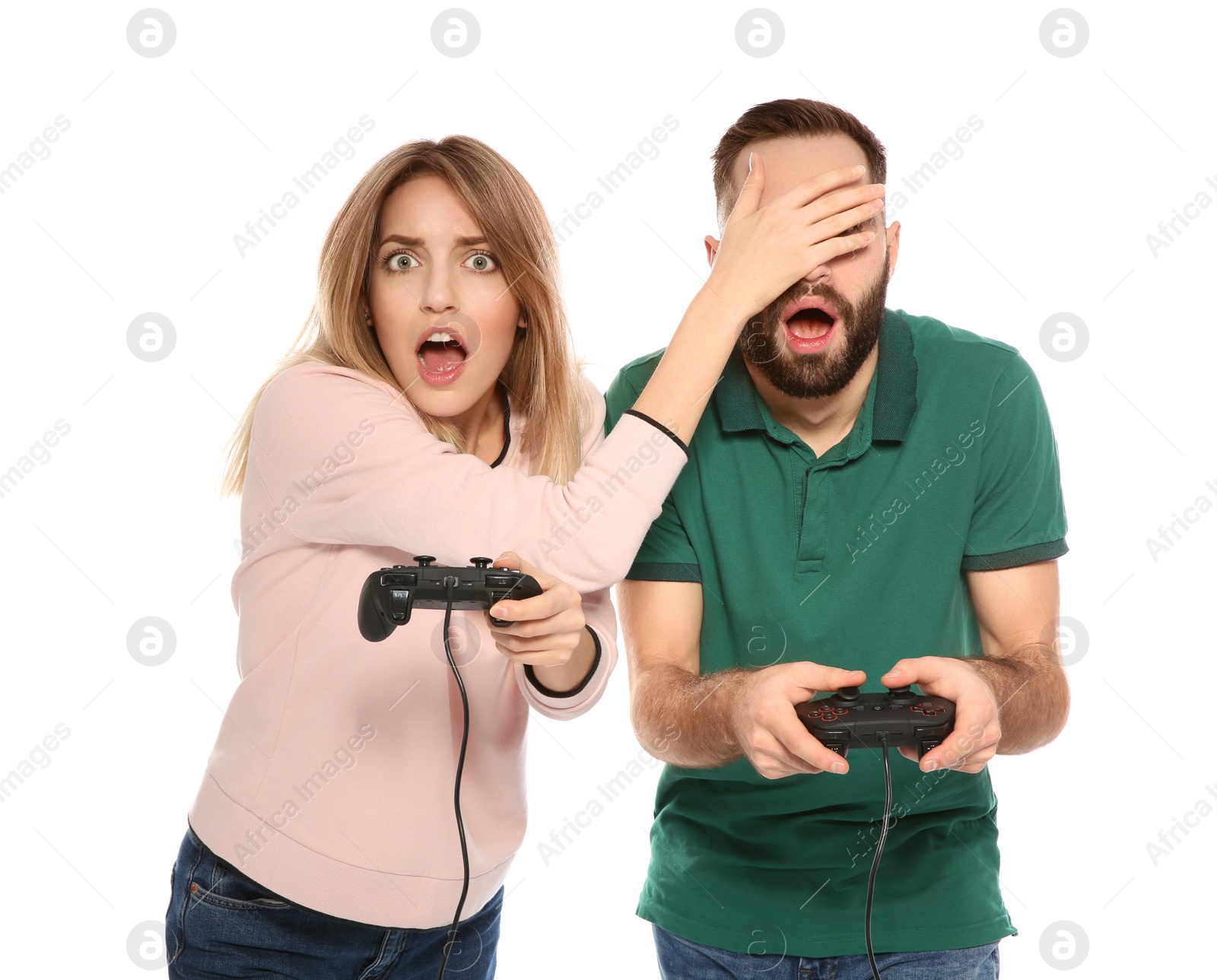 Photo of Emotional couple playing video games with controllers isolated on white