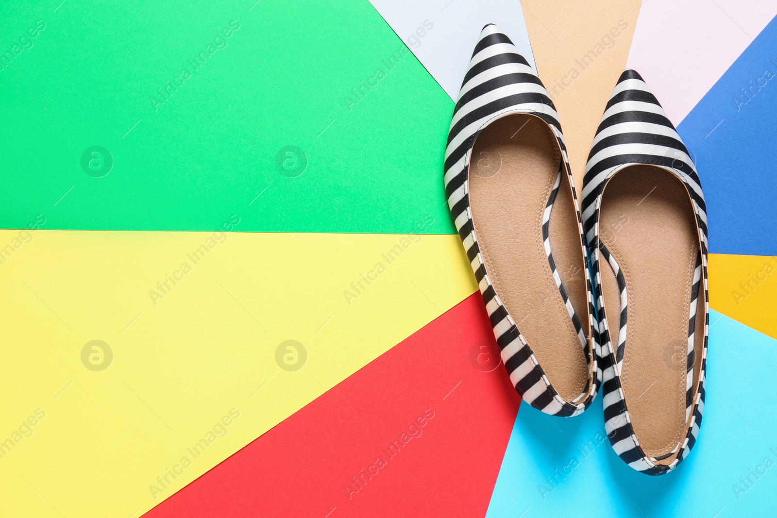 Photo of Stylish woman shoes on color background, top view. Space for text