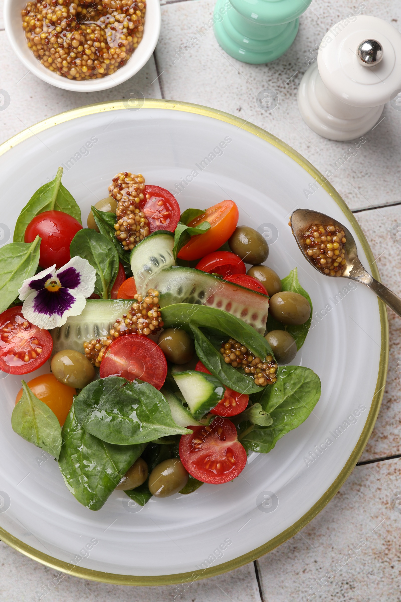 Photo of Delicious salad with vegetables, olives and grain mustard on light table, flat lay