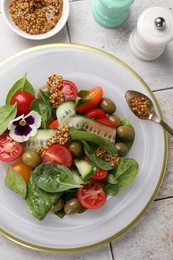 Photo of Delicious salad with vegetables, olives and grain mustard on light table, flat lay