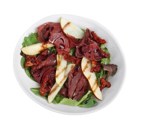 Photo of Delicious bresaola salad with sun-dried tomatoes, pear and balsamic vinegar in bowl isolated on white, top view