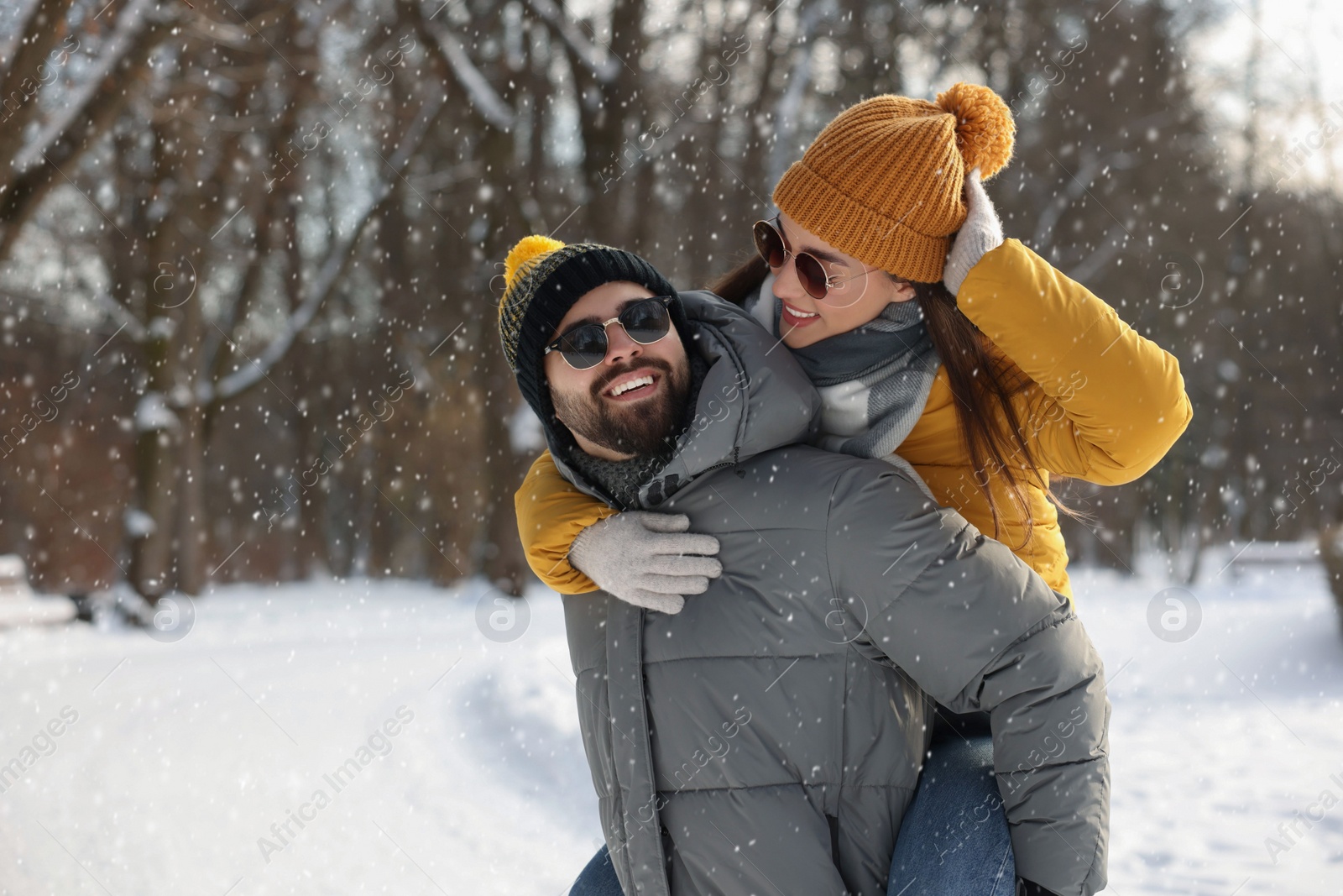 Photo of Happy young couple having fun outdoors on winter day