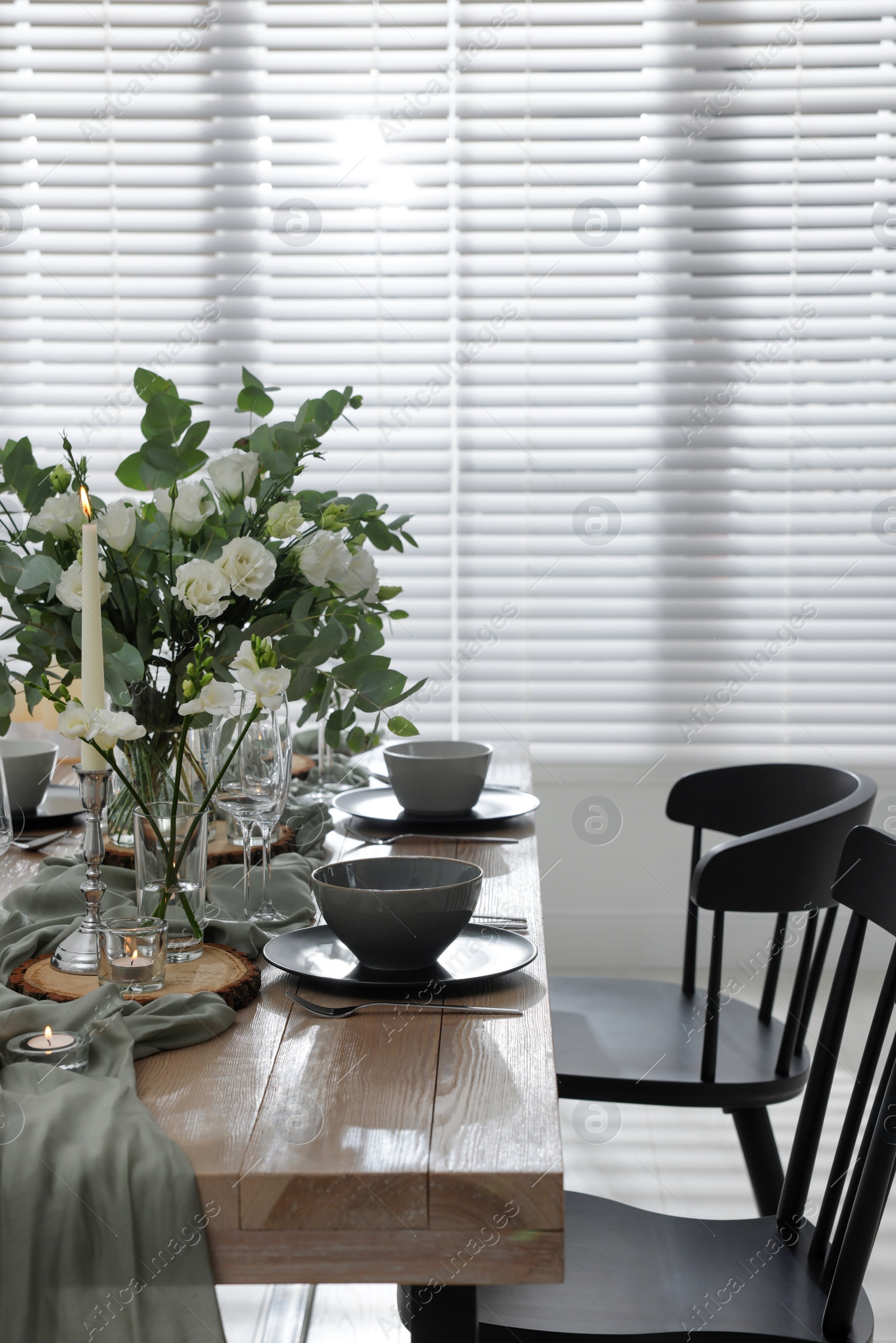 Photo of Festive table setting with beautiful tableware and decor indoors