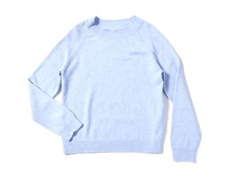 Stylish light blue sweater isolated on white, top view