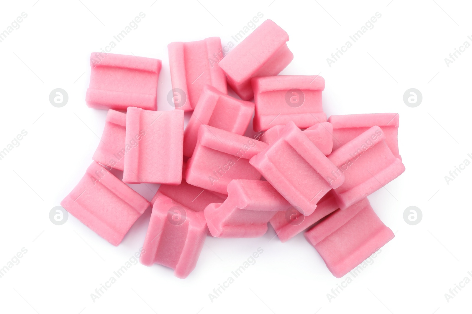 Photo of Pile of tasty pink chewing gums on white background, top view