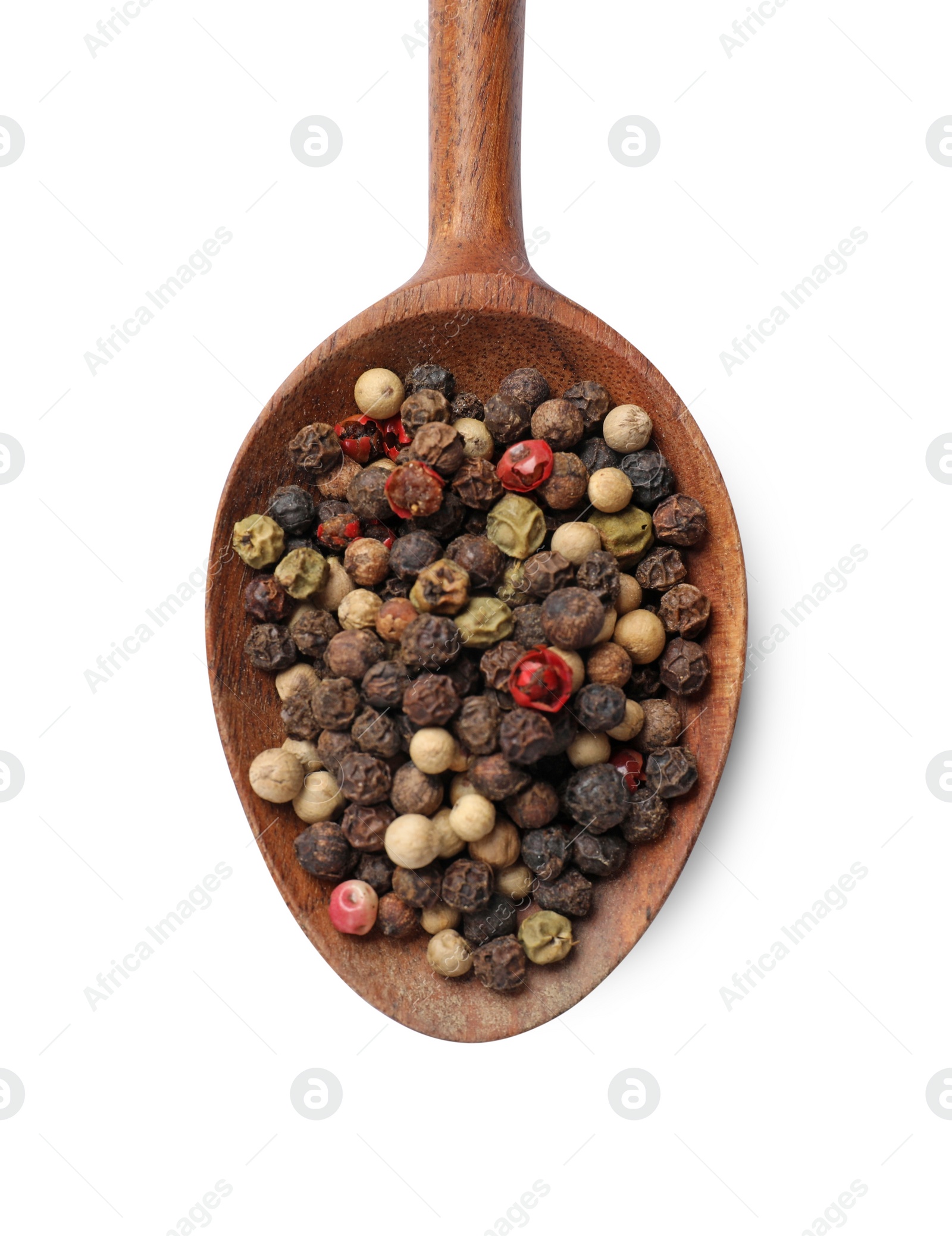 Photo of Aromatic spices. Different peppers in wooden spoon isolated on white, top view