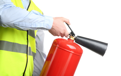 Worker using fire extinguisher on white background, closeup