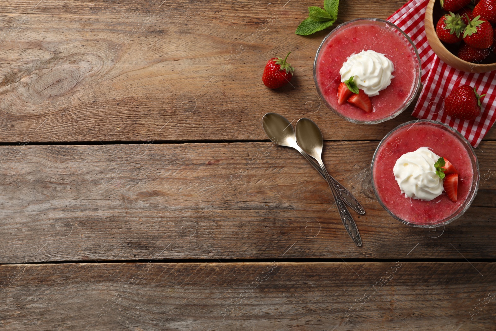Photo of Delicious strawberry mousse with mint on wooden table, flat lay. Space for text