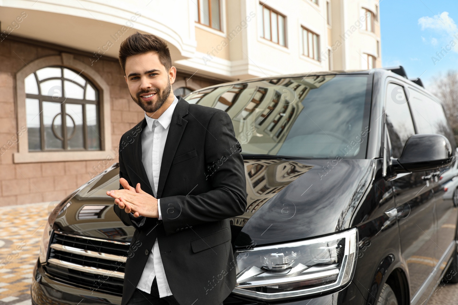 Photo of Handsome young man near modern car outdoors