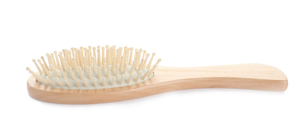 Photo of New wooden hair brush isolated on white