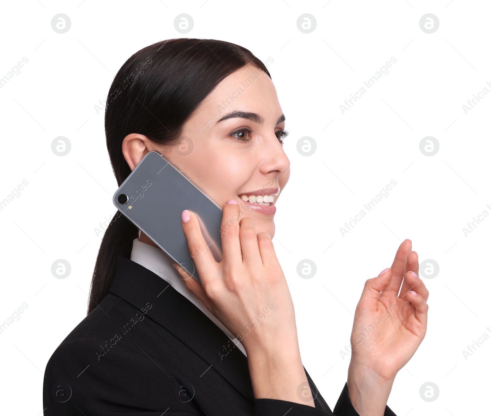 Photo of Young businesswoman talking on mobile phone against white background