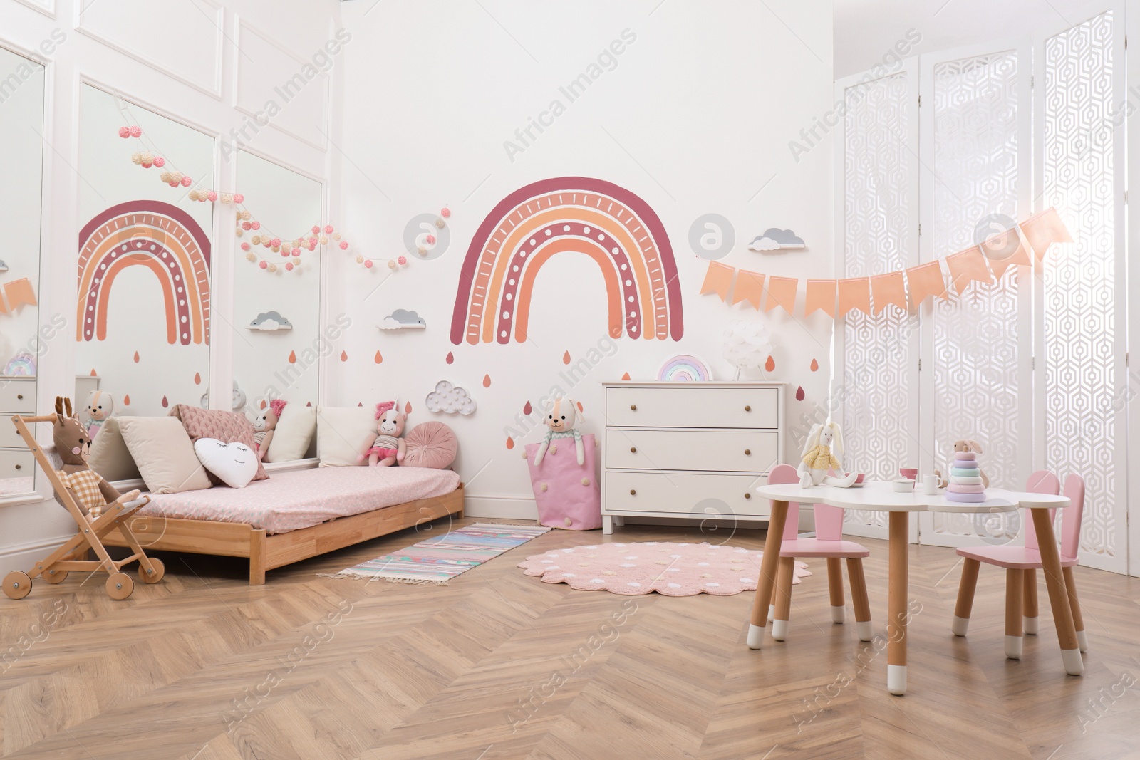 Photo of Montessori bedroom interior with floor bed and toys