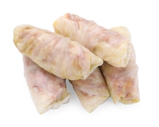 Photo of Uncooked stuffed cabbage rolls isolated on white, top view