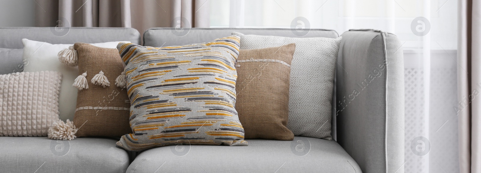 Image of Sofa with pillows in modern living room. Banner design