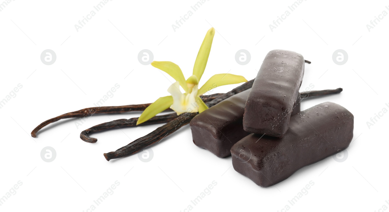 Photo of Glazed curd cheese bars, vanilla pods and flower isolated on white