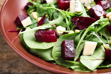 Fresh delicious beet salad on plate, closeup