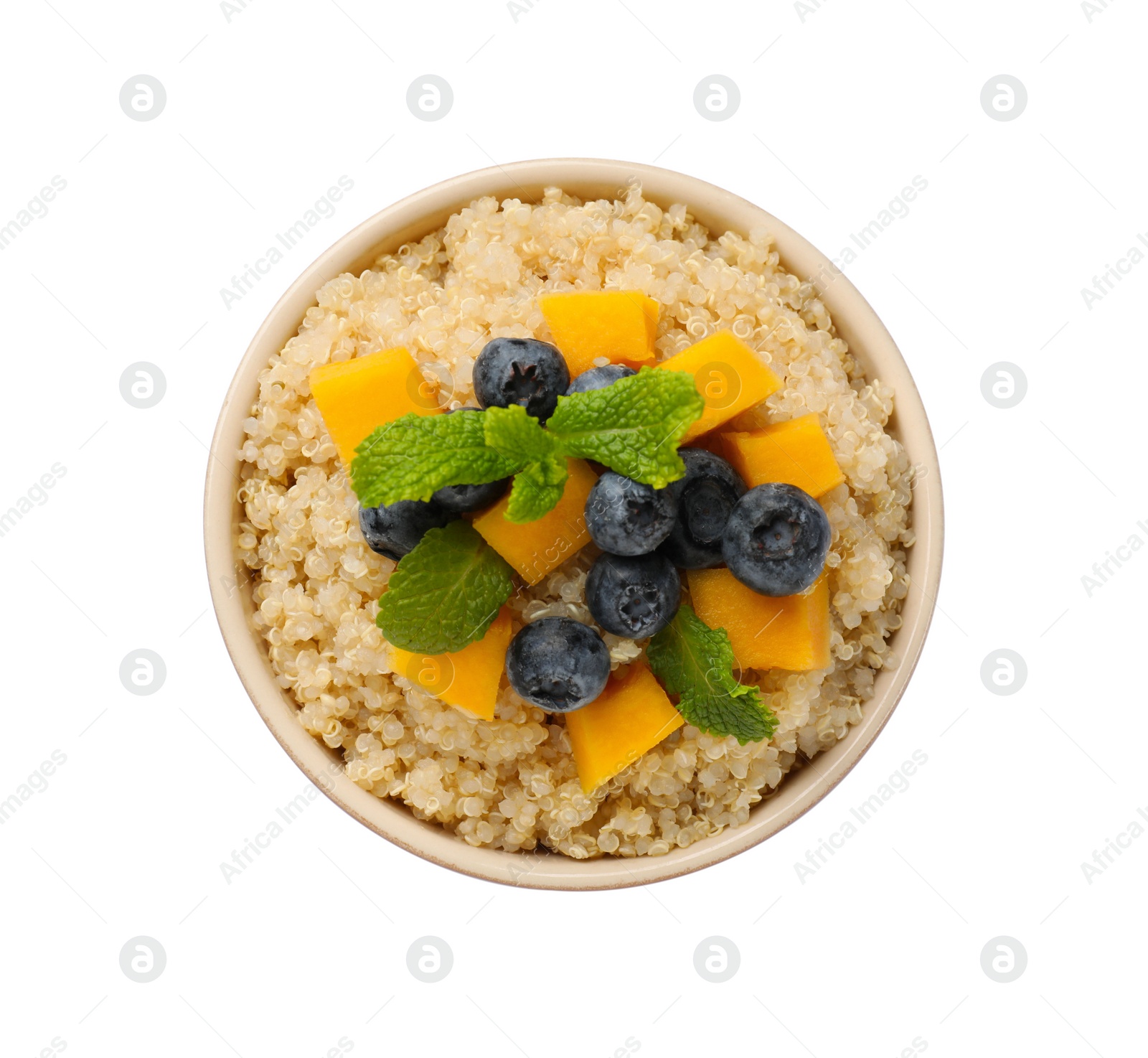 Photo of Tasty quinoa porridge with blueberries, pumpkin and mint in bowl isolated on white, top view