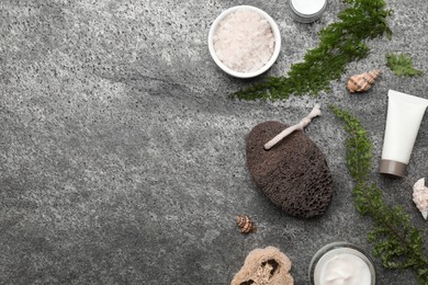 Flat lay composition with pumice stone on grey background. Space for text