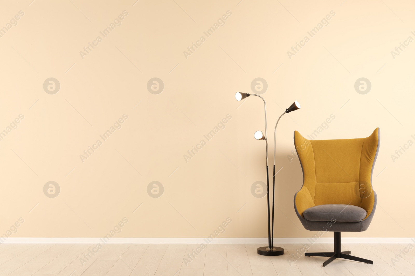 Photo of Stylish living room interior with comfortable armchair and space for text