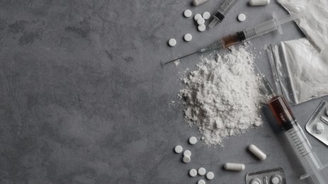 Photo of Many different hard drugs on light grey table, flat lay. Space for text