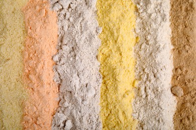Photo of Different types of flours as background, top view