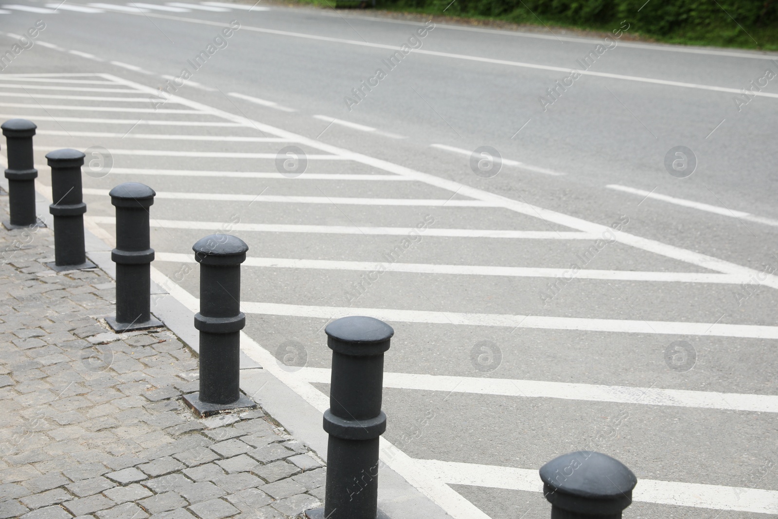 Photo of Empty marked parking slots near road outdoors