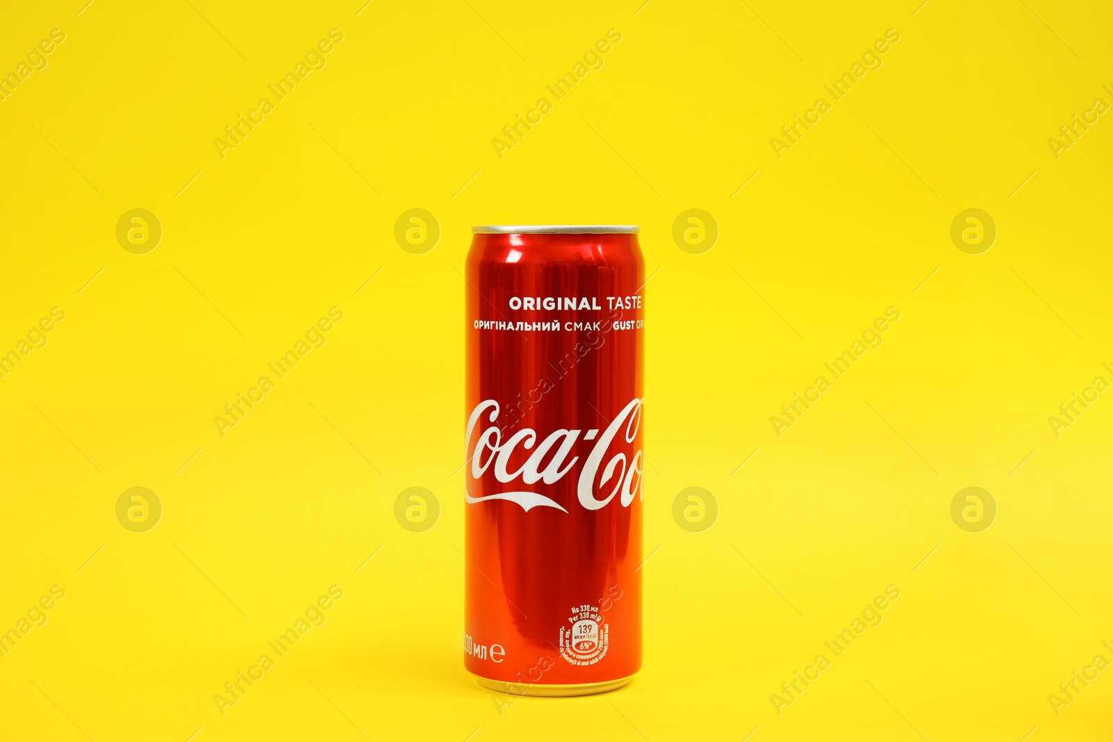 Photo of MYKOLAIV, UKRAINE - NOVEMBER 14, 2018: Coca-Cola can on color background