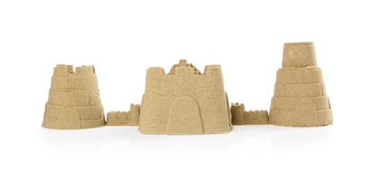 Three different sand castles isolated on white