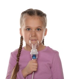 Photo of Little girl using nebulizer for inhalation on white background