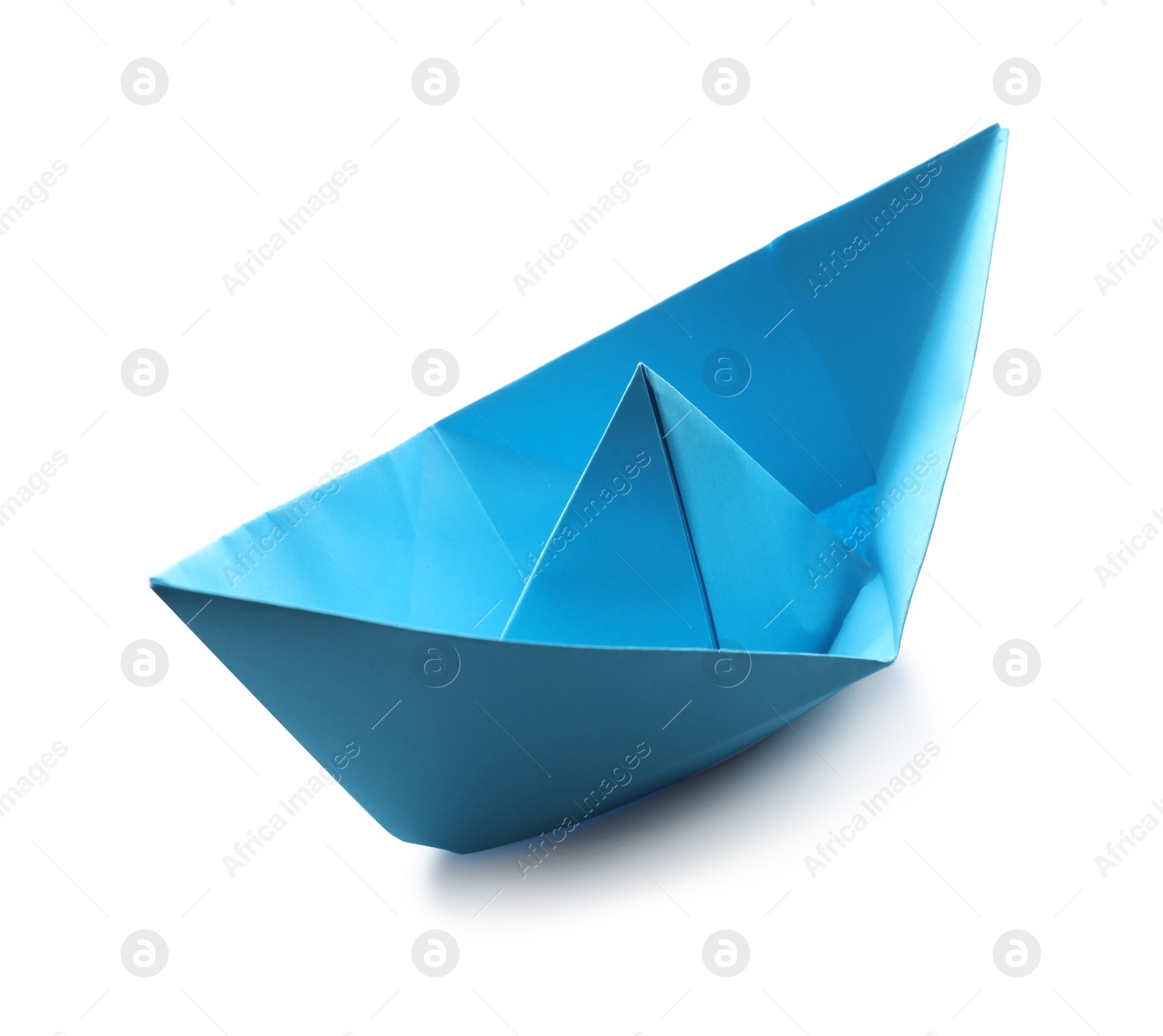 Photo of Handmade light blue paper boat isolated on white. Origami art