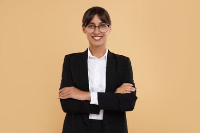 Photo of Portrait of happy secretary on beige background