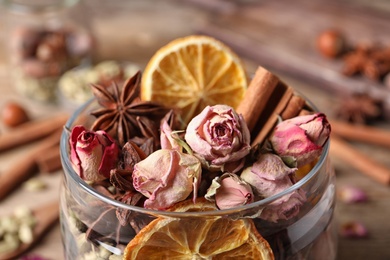 Photo of Aroma potpourri with different spices in jar, closeup view
