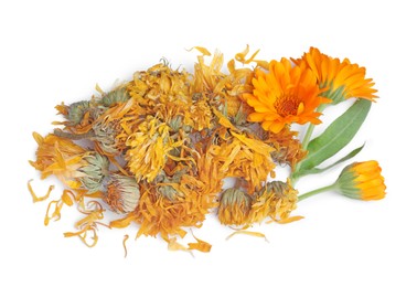 Photo of Pile of dry and fresh calendula flowers on white background, top view