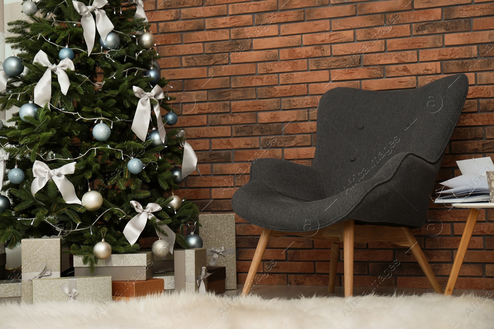 Photo of Stylish living room interior with decorated Christmas tree