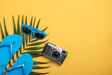 Photo of Flat lay composition with collection of beach objects on color background