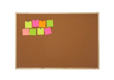 Empty notes pinned to cork board on white background