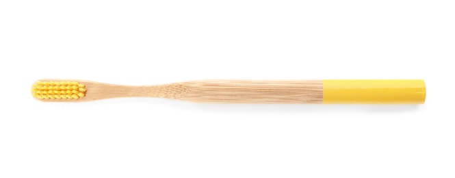 Photo of Toothbrush made of bamboo on white background, top view