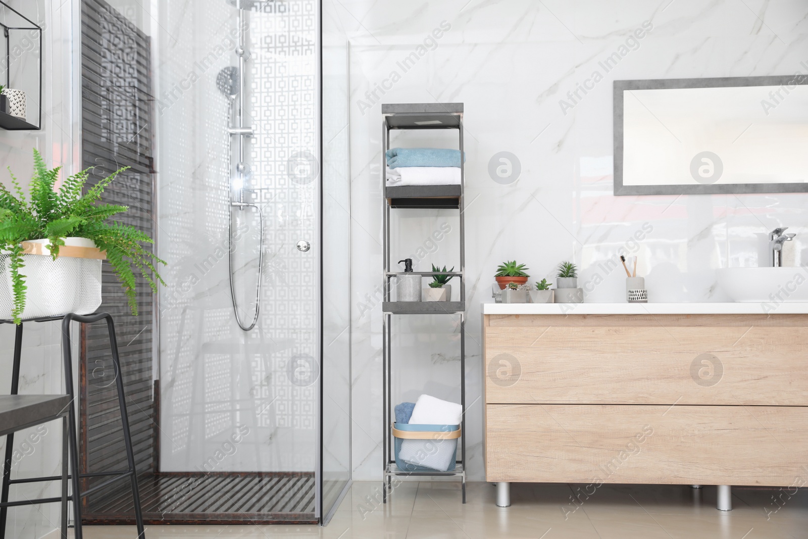 Photo of Bathroom interior with shower stall and counter. Idea for design