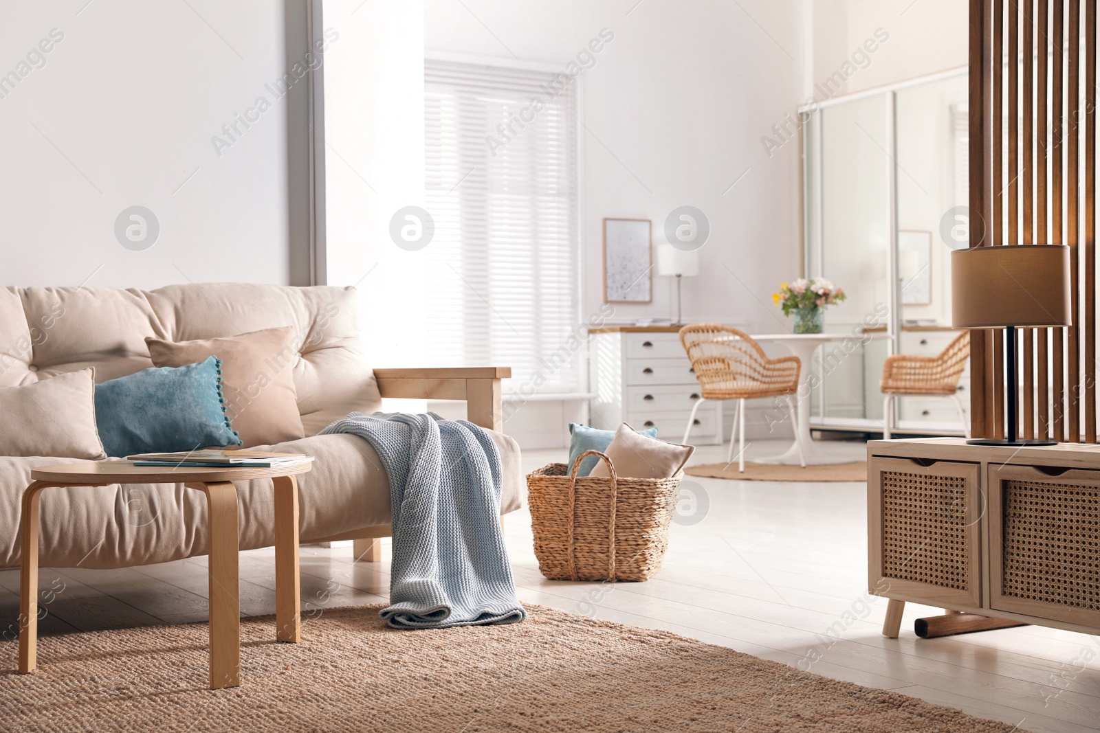 Photo of Spacious apartment interior with console table and comfortable sofa