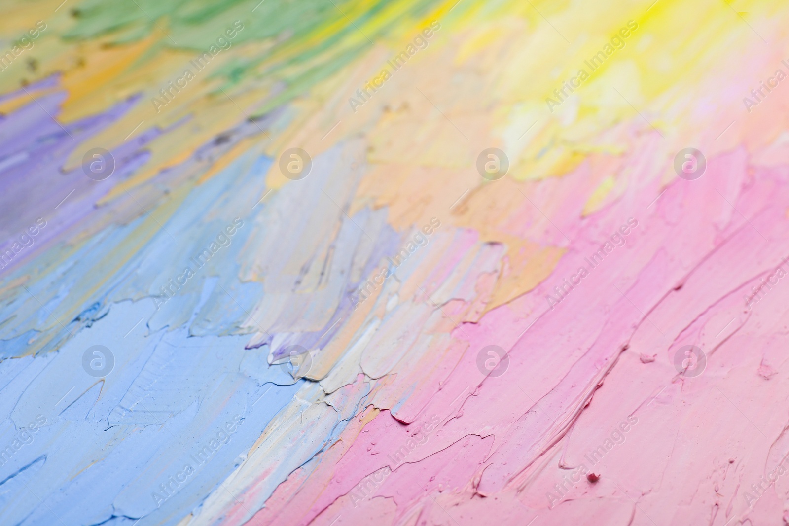 Photo of Beautiful strokes of pastel oil paints as background, closeup