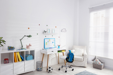 Modern child room interior with stylish furniture