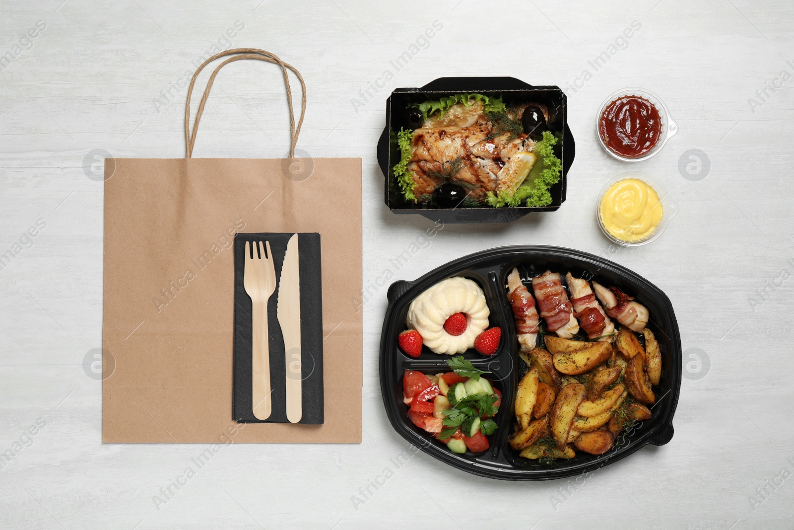 Photo of Flat lay composition with lunchboxes on white table. Healthy food delivery