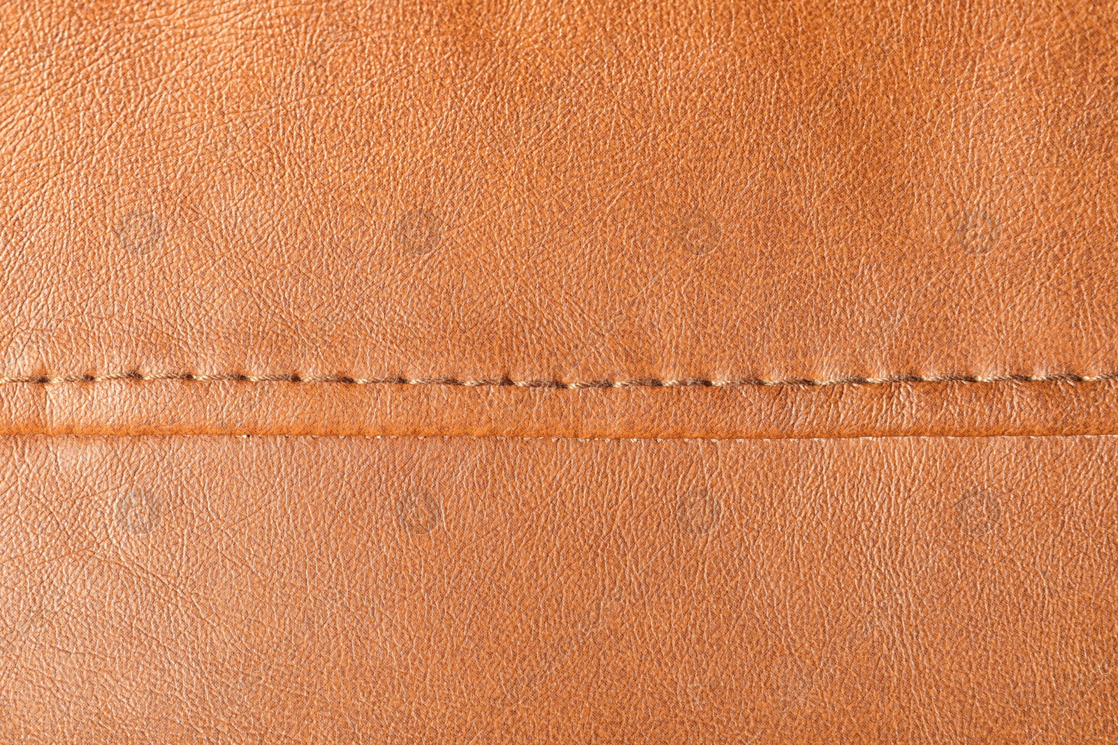 Photo of Texture of orange leather as background, closeup