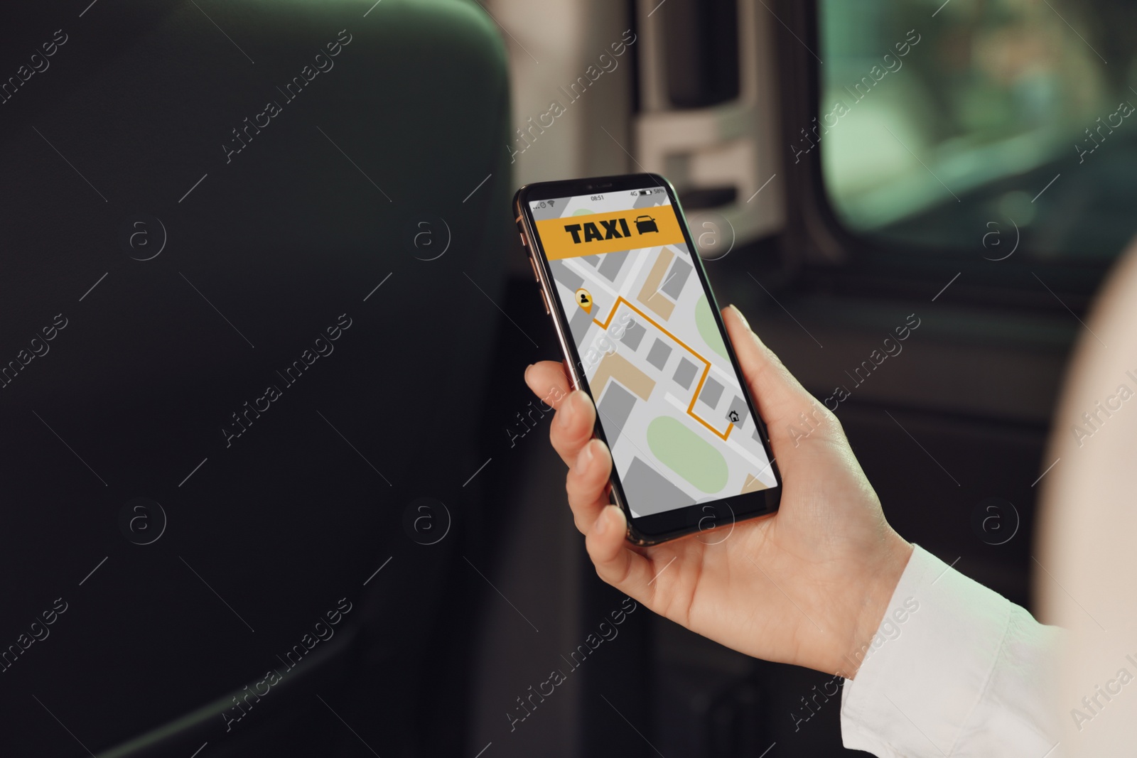 Photo of Woman with mobile phone in taxi salon, closeup