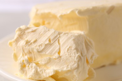 Tasty homemade butter on plate, closeup view