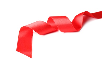 Photo of Simple red ribbon on white background. Festive decoration