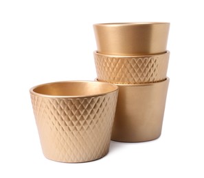 Photo of Golden empty ceramic flower pots on white background