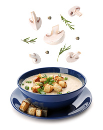 Image of Fresh mushrooms, rosemary and peppercorns falling into bowl with homemade soup on white background