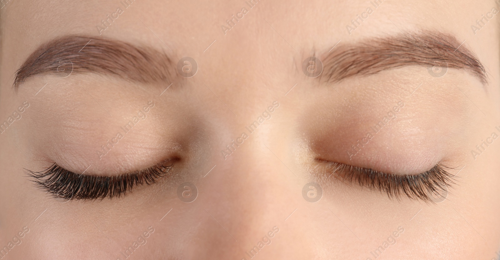 Image of Young woman with beautiful eyelashes, closeup. Before and after extension procedure