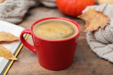 Photo of Cup of hot drink on wooden table. Cozy autumn atmosphere